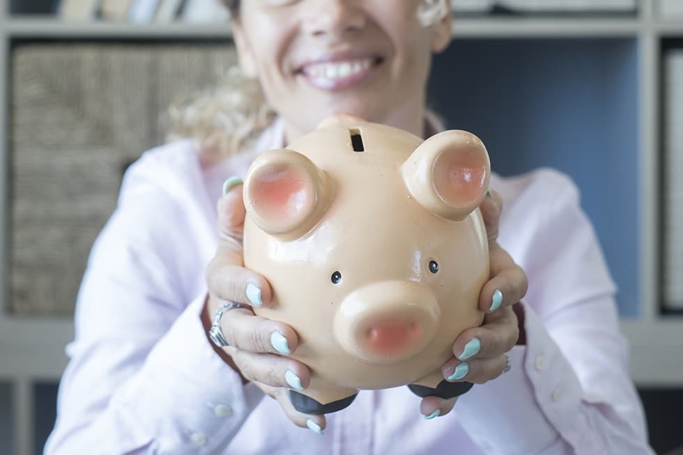 An employer holding a piggy bank, symbolizing their responsibility to contribute to employees' superannuation